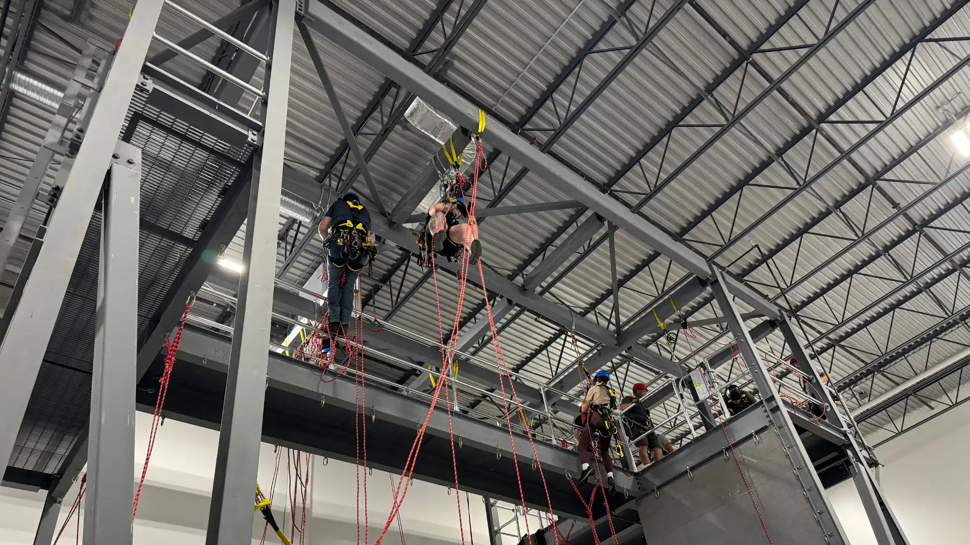 SPRAT rope access refresher training with technicians practicing advanced maneuvers at MCL Height Safety Calgary