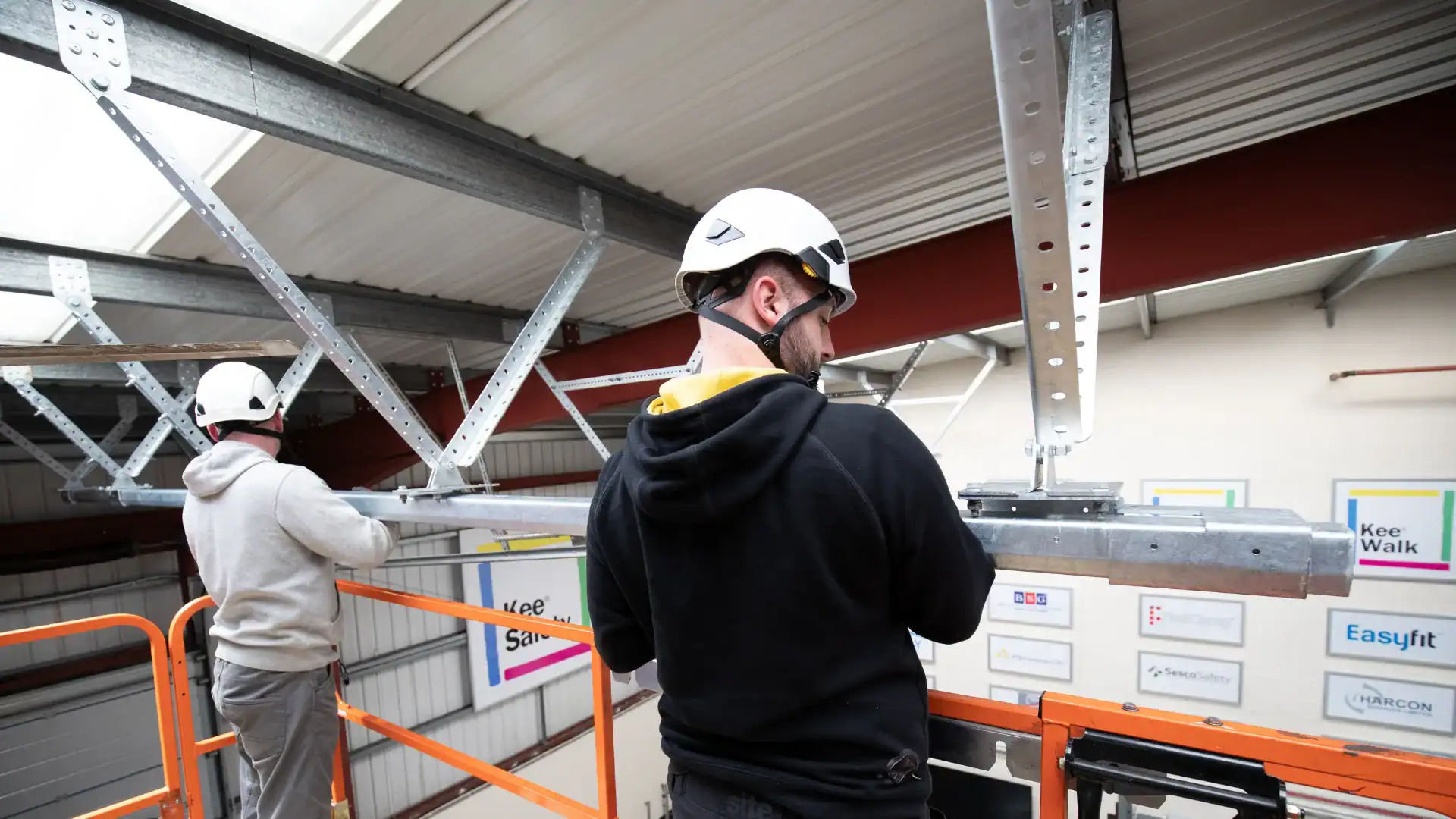 Kee Track rigid rail fall protection system installed on industrial rooftop Calgary Canada